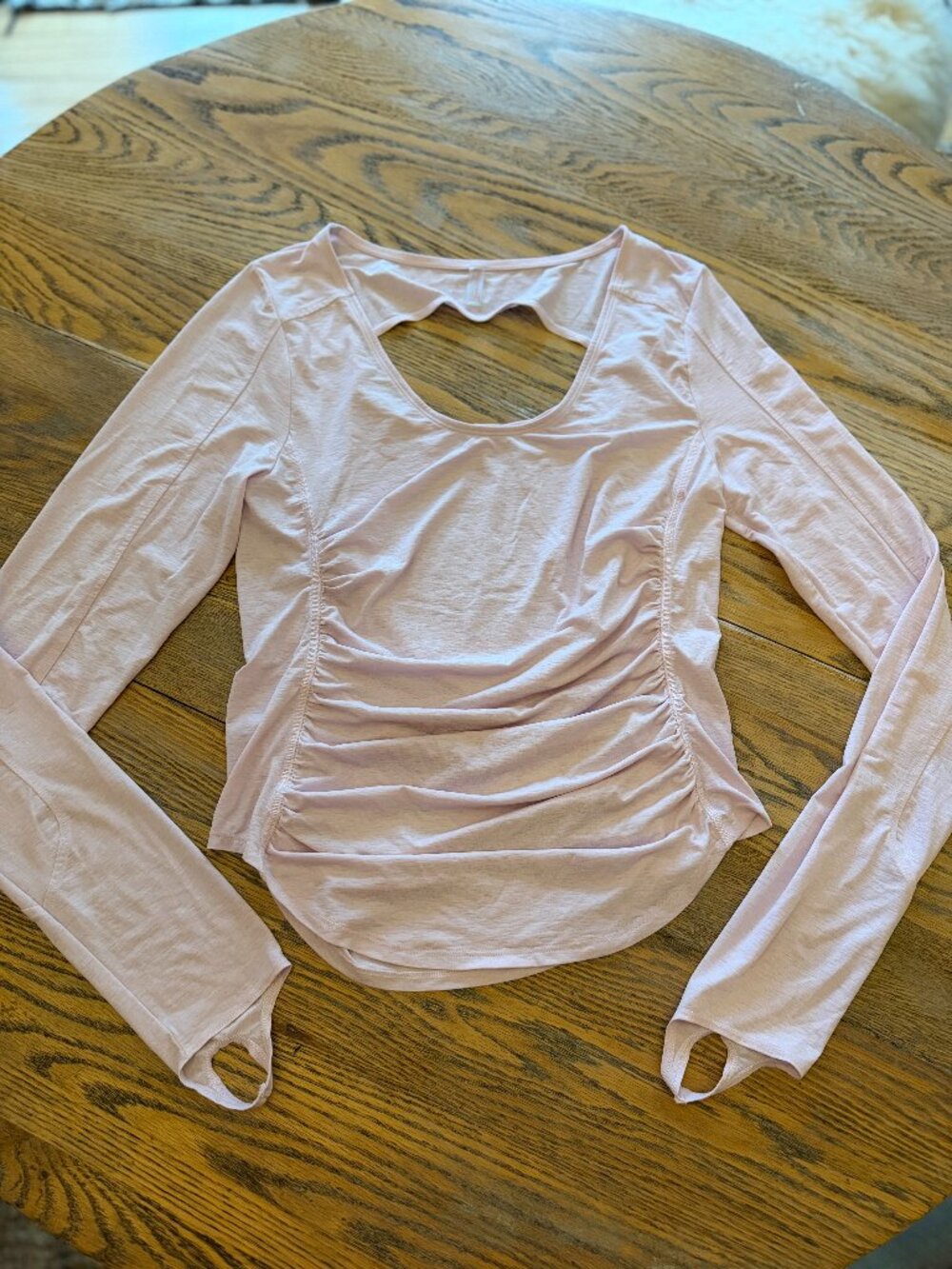 FREE PEOPLE light pink cut out back, thumb holes, ruched sides/exc cond/XL
